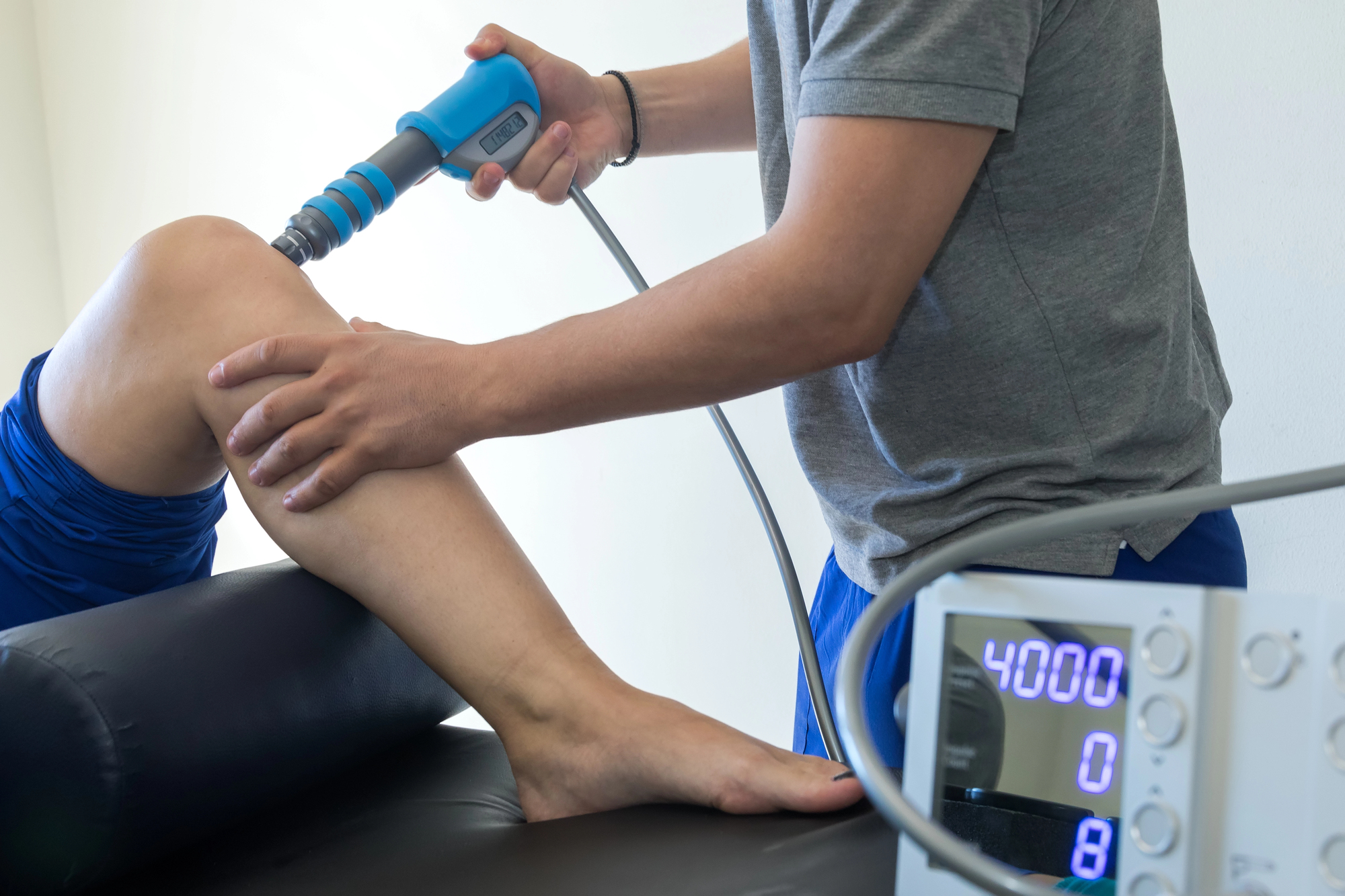 Physiotherapist providing shockwave therapy treatment to a patient at Back2Fitness Physiotherapy in Walsall.